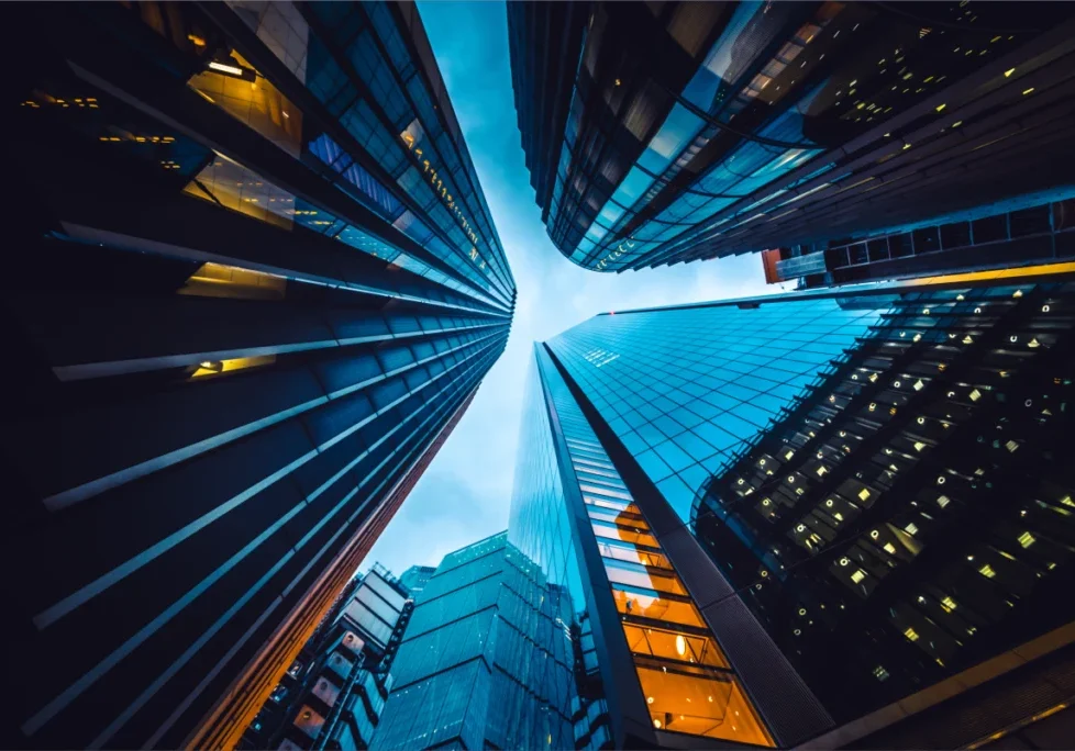 A view of some skyscrapers from below.