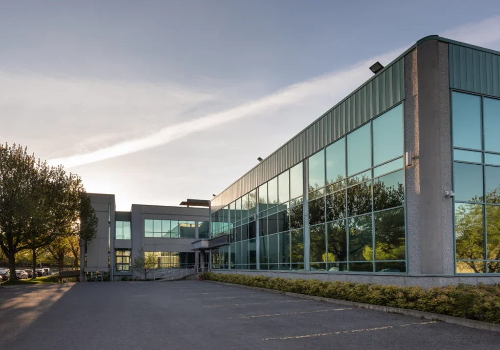 A large building with many windows and trees